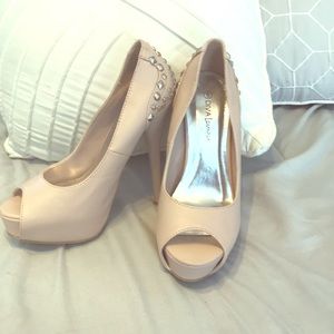 Soft pink open toe pumps